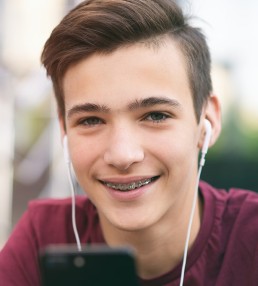 boy with headphones smiling