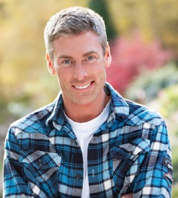 man in blue shirt smiling