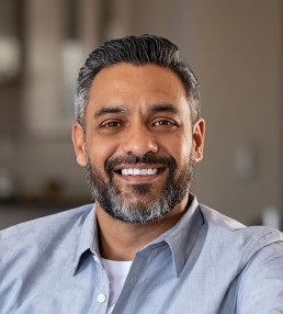 smiling south asian man