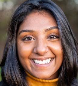 smiling south asian young woman