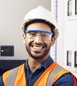 smiling young man in hard hat